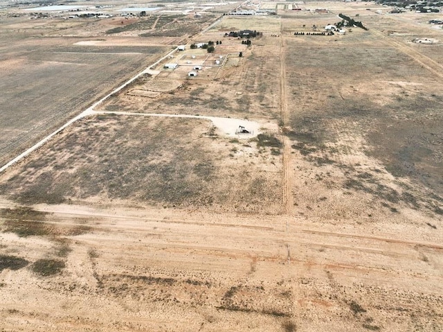 birds eye view of property with a rural view