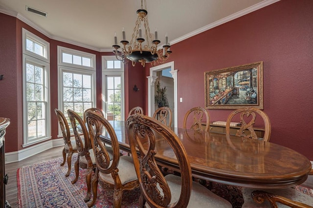 dining room featuring a notable chandelier, brick wall, lofted ceiling, and beverage cooler