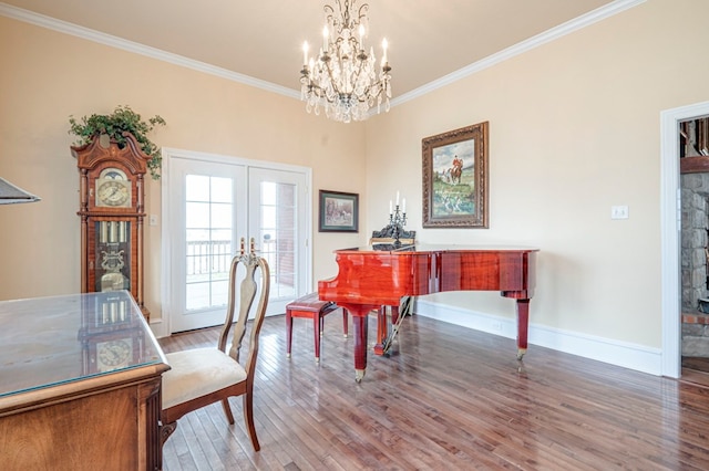 office with french doors, hardwood / wood-style flooring, an inviting chandelier, and ornamental molding