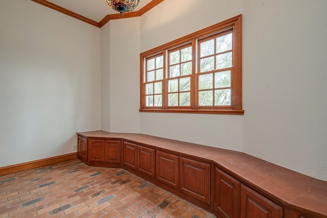 unfurnished room featuring ornamental molding