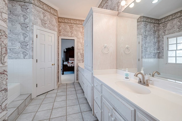 bathroom featuring vanity, tile patterned floors, a shower with door, and ornamental molding