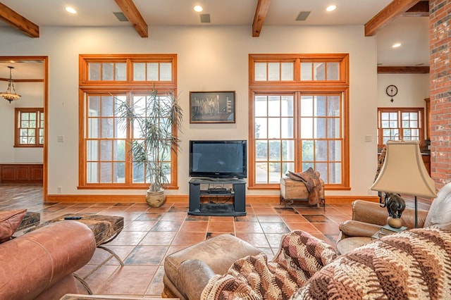 living room with tile patterned flooring and beam ceiling