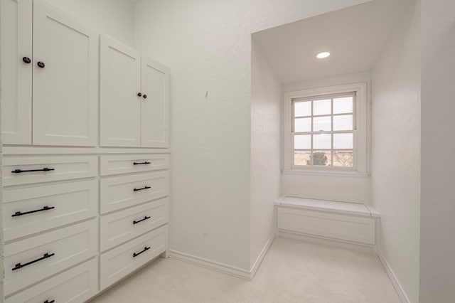 bathroom featuring a tub to relax in, tile patterned floors, and crown molding