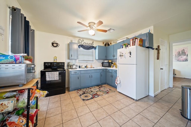 1101 Barnes Ave, Big Spring, TX 79720 - kitchen with black appliances, blue cabinetry, ceiling fan, light countertops, and light tile patterned floors