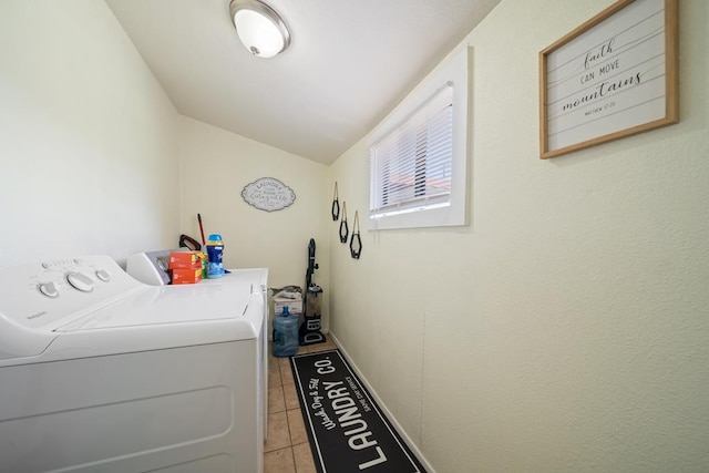 1101 Barnes Ave, Big Spring, TX 79720 - washroom featuring washing machine and clothes dryer and light tile patterned flooring