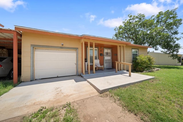 1101 Barnes Ave, Big Spring, TX 79720 - ranch-style house featuring driveway, a garage, a front lawn, and a porch