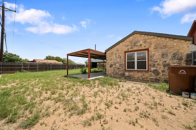 1101 Barnes Ave, Big Spring, TX 79720 - fenced backyard with a patio