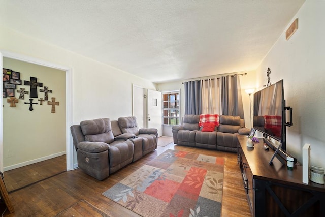 1101 Barnes Ave, Big Spring, TX 79720 - living room featuring hardwood / wood-style flooring and baseboards