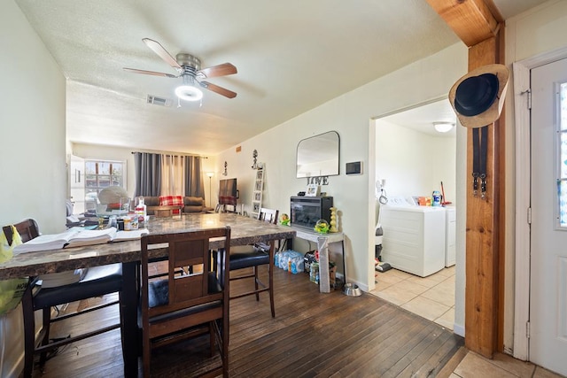 1101 Barnes Ave, Big Spring, TX 79720 - dining room with ceiling fan, wood finished floors, and washing machine and dryer