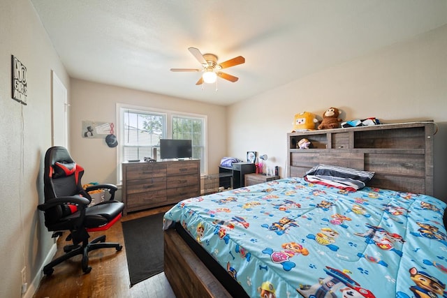 1101 Barnes Ave, Big Spring, TX 79720 - bedroom with wood finished floors and a ceiling fan