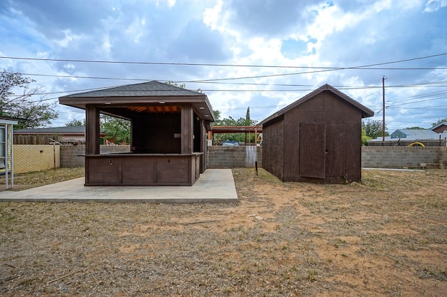 404W Jax Ave, Midland, TX 79701 - view of shed with a fenced backyard and a gazebo