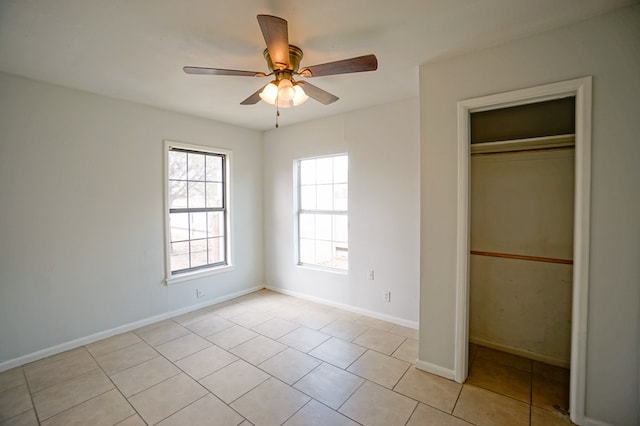 404W Jax Ave, Midland, TX 79701 - unfurnished bedroom featuring a closet, light tile patterned floors, and ceiling fan