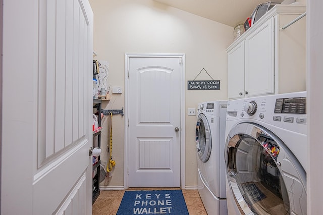 laundry area with washer and dryer and cabinet space