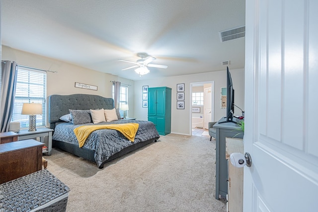 bedroom featuring light carpet, multiple windows, ceiling fan, and baseboards