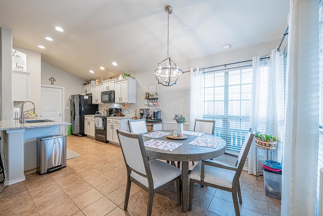 dining room featuring lofted ceiling, a chandelier, recessed lighting, and light tile patterned floors