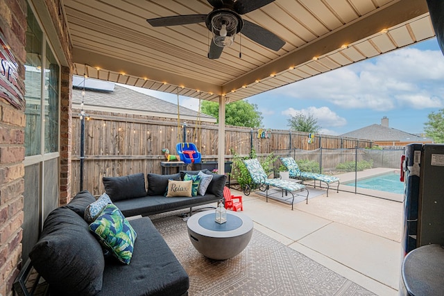 view of patio / terrace featuring a fenced backyard, an outdoor hangout area, and a ceiling fan