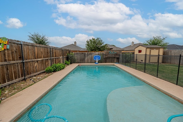 view of pool with a fenced backyard