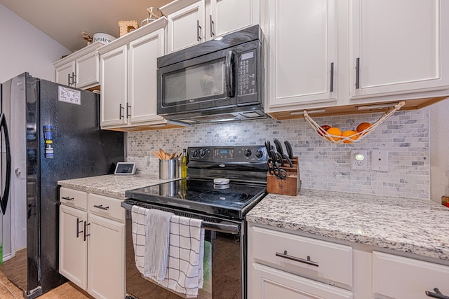 kitchen featuring black appliances, backsplash, white cabinets, and light stone counters