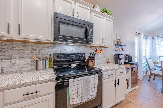 kitchen with black appliances, backsplash, white cabinetry, and light stone countertops