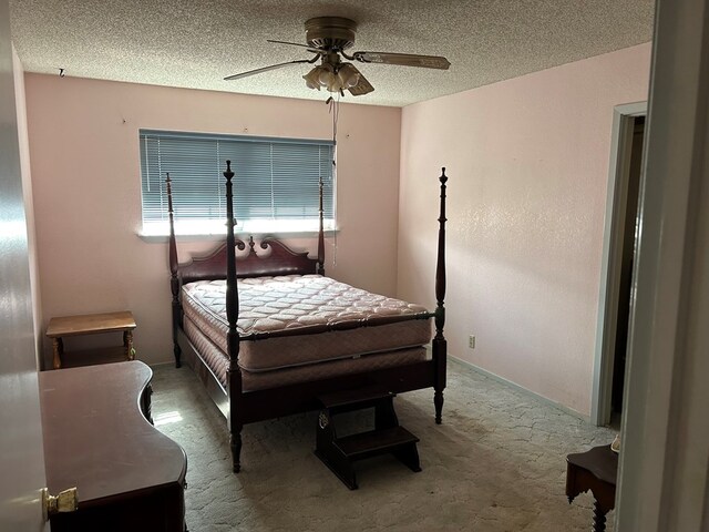 3210 Park Ln, Midland, TX 79701 - bedroom with carpet, a textured ceiling, and a ceiling fan