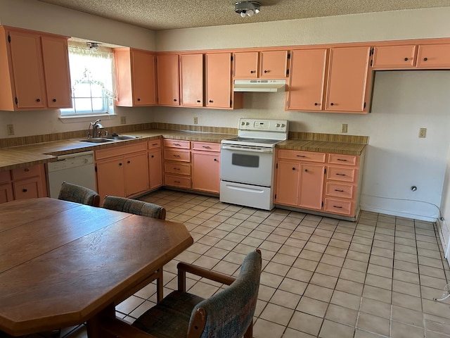3210 Park Ln, Midland, TX 79701 - kitchen featuring white appliances, a sink, under cabinet range hood, tile countertops, and light tile patterned floors