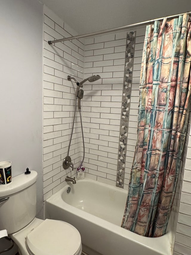 full bathroom with shower / bath combo with shower curtain and toilet