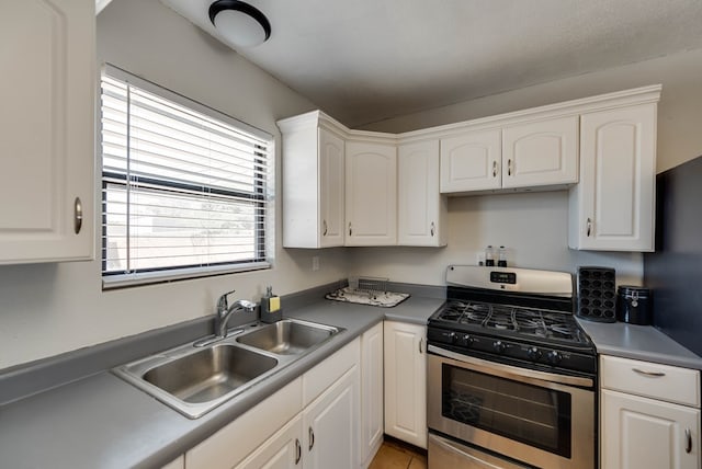 2724 E 11th St, Odessa, TX 79761 - kitchen featuring a sink, stainless steel gas stove, and white cabinets