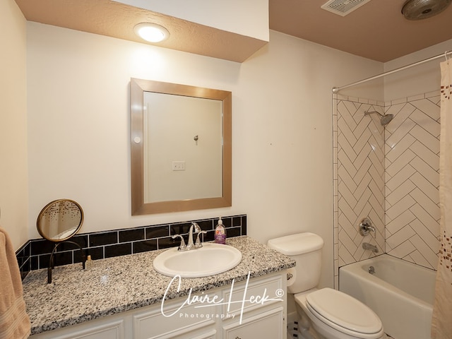 bathroom with toilet, shower / bath combo, visible vents, and vanity