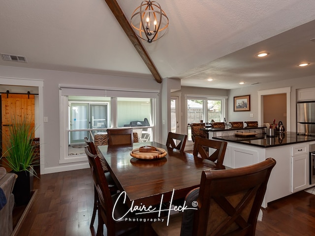 dining room featuring dark wood-style floors, a barn door, visible vents, and recessed lighting