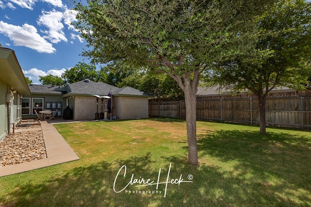 view of yard with fence private yard and a patio area