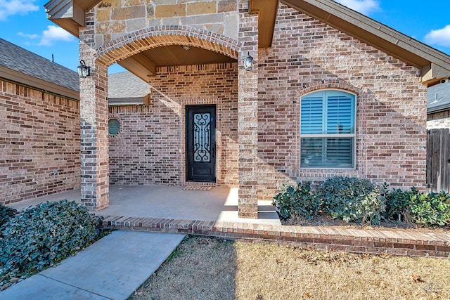 property entrance with a patio area