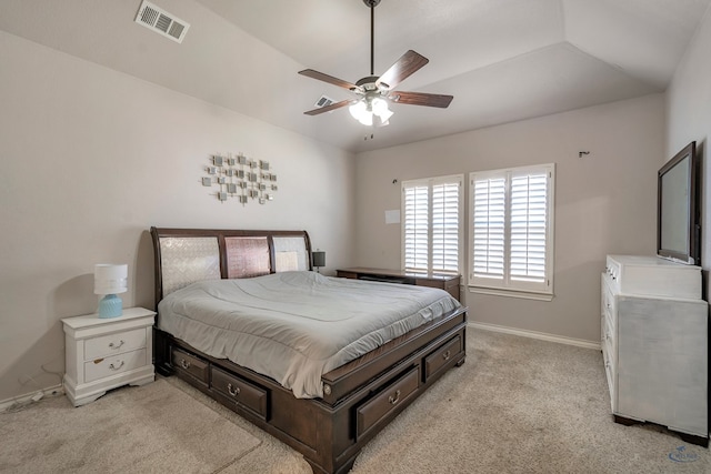 carpeted bedroom with vaulted ceiling and ceiling fan