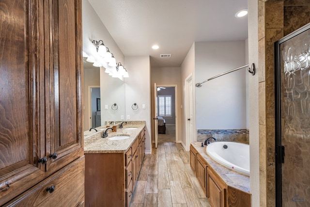 bathroom with vanity and plus walk in shower