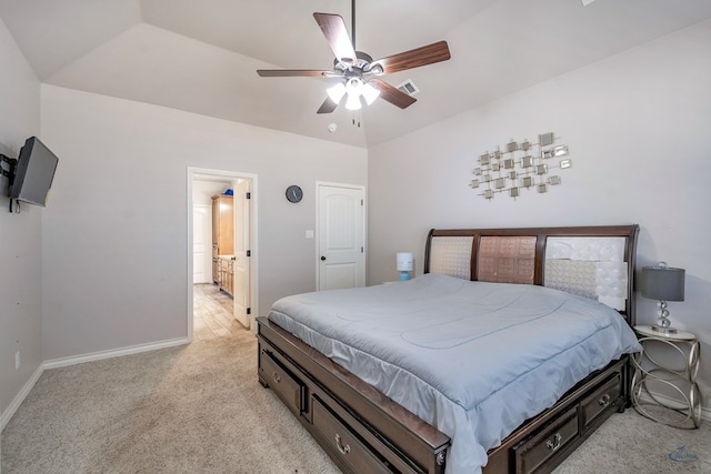 bedroom featuring ceiling fan, vaulted ceiling, and light carpet