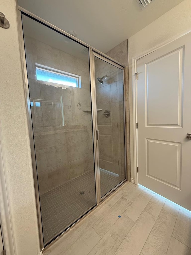 bathroom with a stall shower