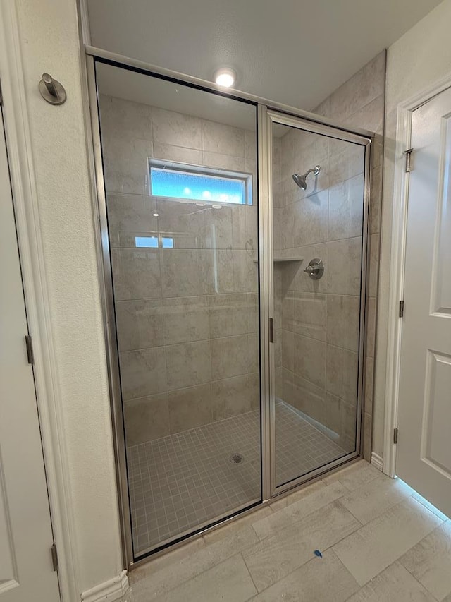 bathroom with a stall shower