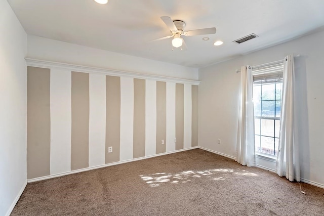 spare room with carpet flooring and ceiling fan