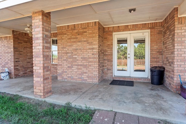 entrance to property featuring french doors and a patio