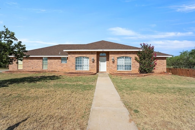 single story home with a front lawn