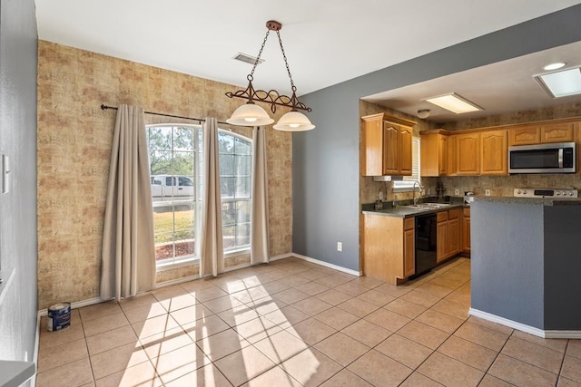 kitchen featuring sink, light tile patterned floors, pendant lighting, and black dishwasher