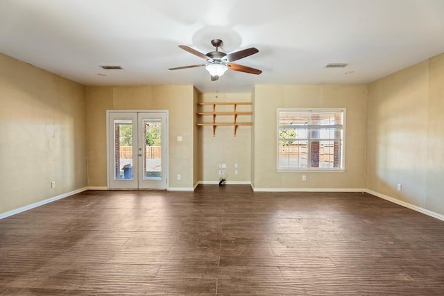 unfurnished living room with ceiling fan, french doors, and dark hardwood / wood-style floors