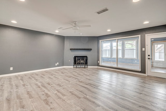 unfurnished living room featuring visible vents, wood finished floors, a fireplace, ceiling fan, and recessed lighting