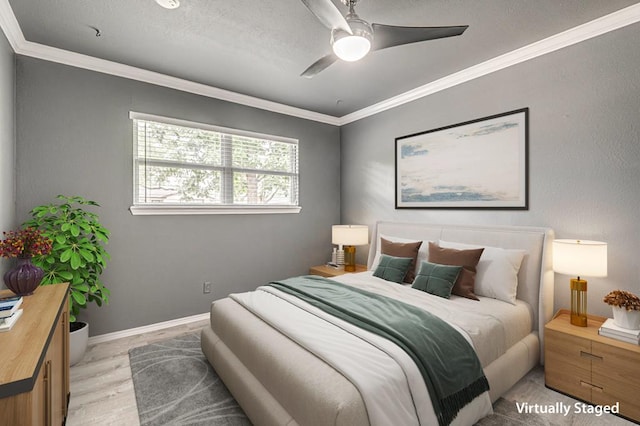 bedroom featuring baseboards, ornamental molding, and a ceiling fan