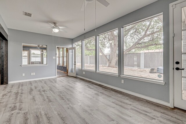 unfurnished sunroom with visible vents