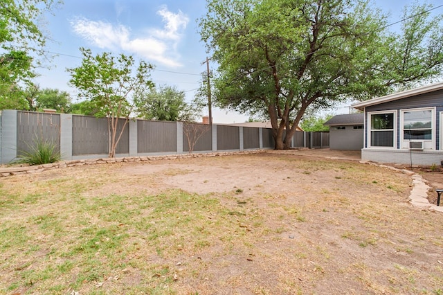 view of yard with a fenced backyard and cooling unit