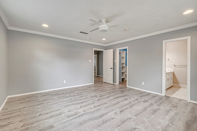 unfurnished bedroom featuring recessed lighting, baseboards, a spacious closet, and light wood finished floors