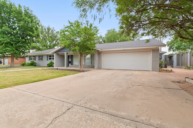 single story home featuring a front yard, brick siding, an attached garage, driveway, and a porch