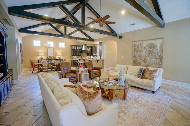 5319 Half Moon Cir, Midland, TX 79707 - living room with arched walkways, baseboards, ceiling fan, and recessed lighting