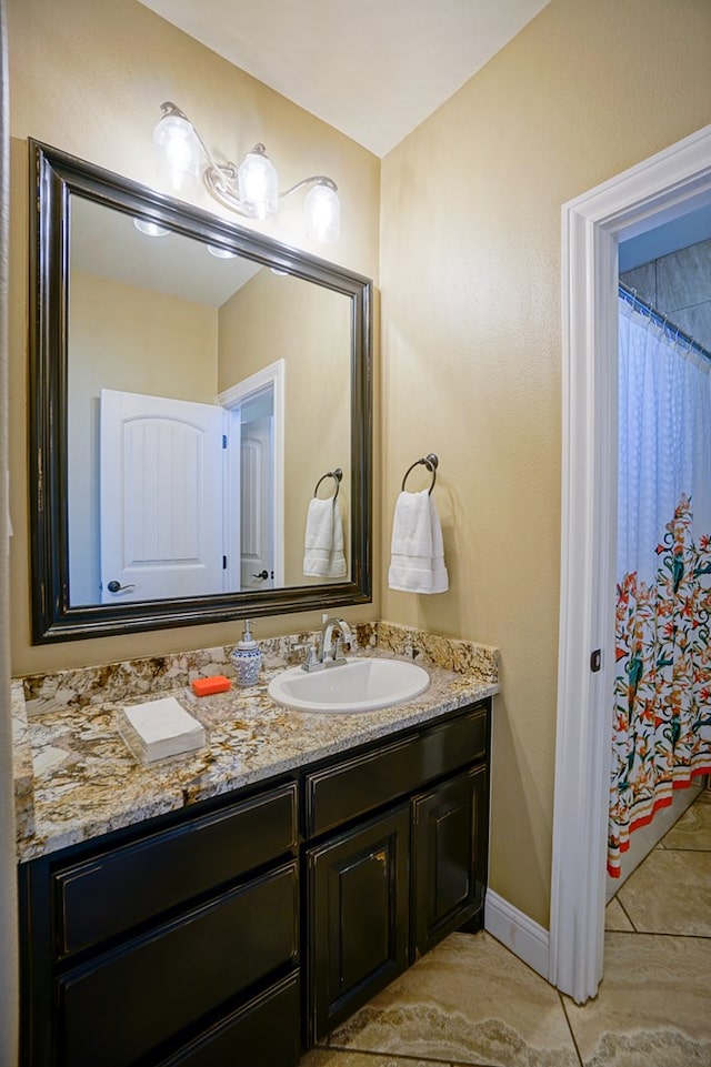 5319 Half Moon Cir, Midland, TX 79707 - full bathroom with vanity and baseboards