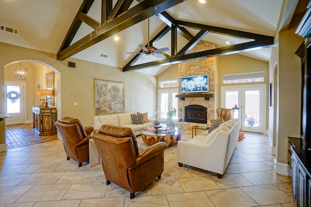 5319 Half Moon Cir, Midland, TX 79707 - living area featuring arched walkways, a stone fireplace, high vaulted ceiling, a ceiling fan, and recessed lighting